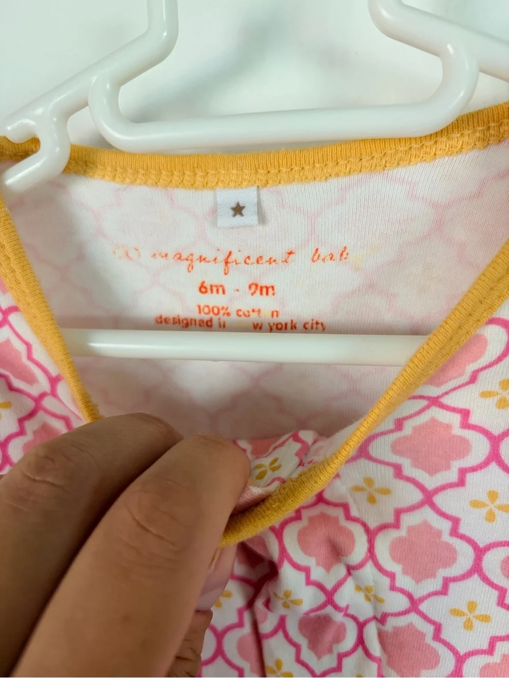 Magnificent Baby Pink Geometric Footed One-Piece with Yellow Trim